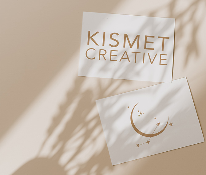 Kismet Creative logos displayed on white business cards